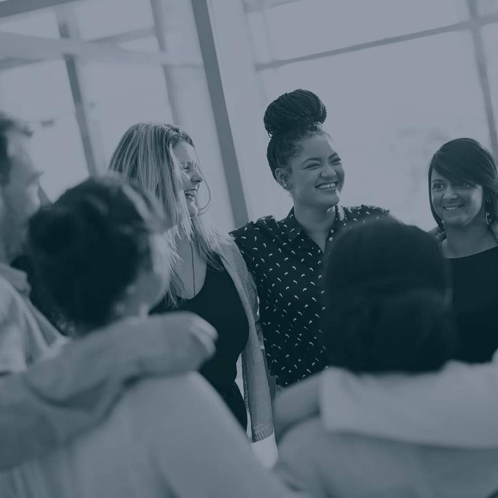 Group of people smiling and being together connected.