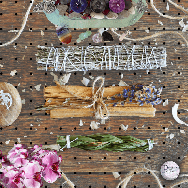 a group of herbs and flowers on a peg board