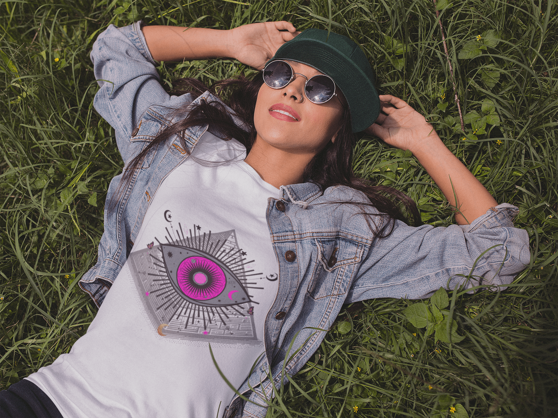 mockup-of-a-trendy-girl-wearing-a-t-shirt-lying-in-the-grass-a11735klih all seeing eye t shirt