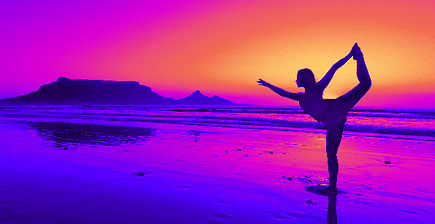 Image Of Woman On The Beach With A Beautiful Sunset Behind Her As She Does Yoga.