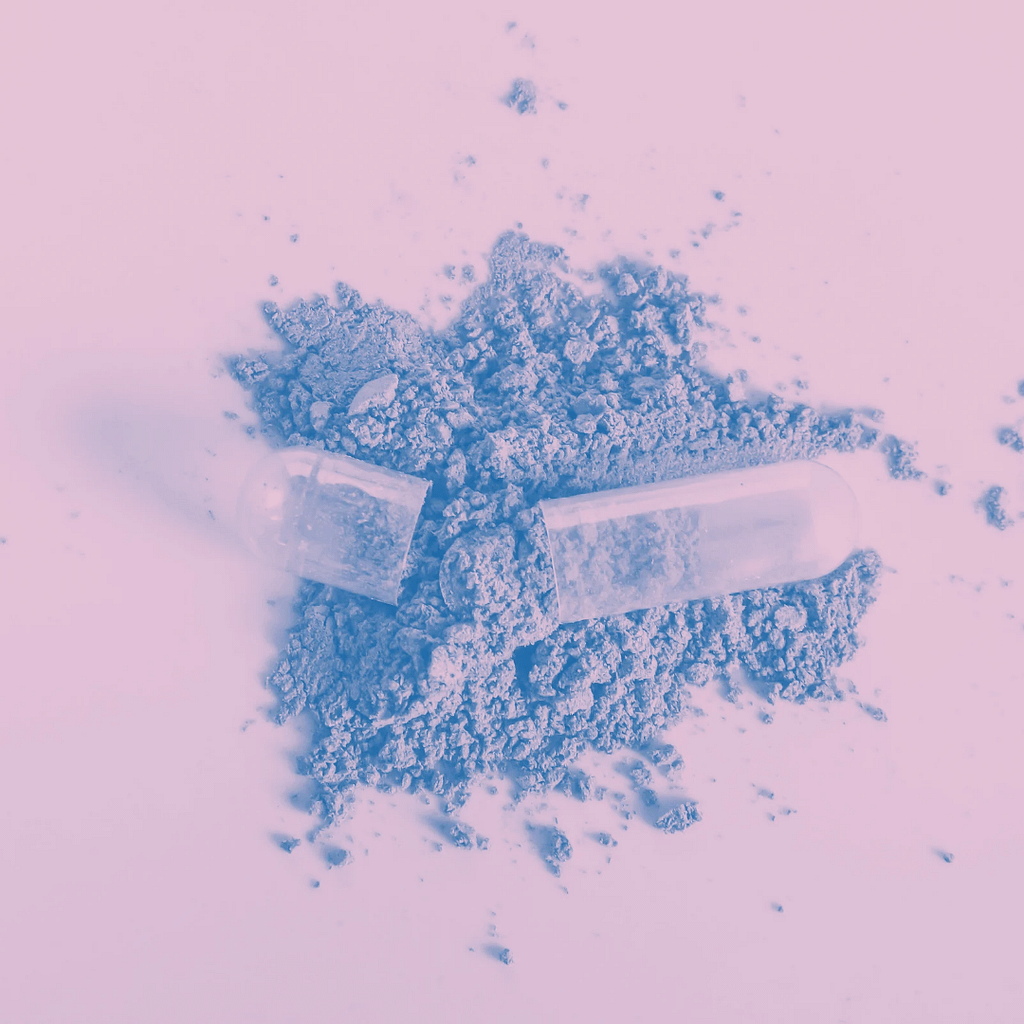 Comprehensive Guide To Navigating Kratom Withdrawal 3 An Open Pull Capsule Atop A Pile Of Kratom Powder