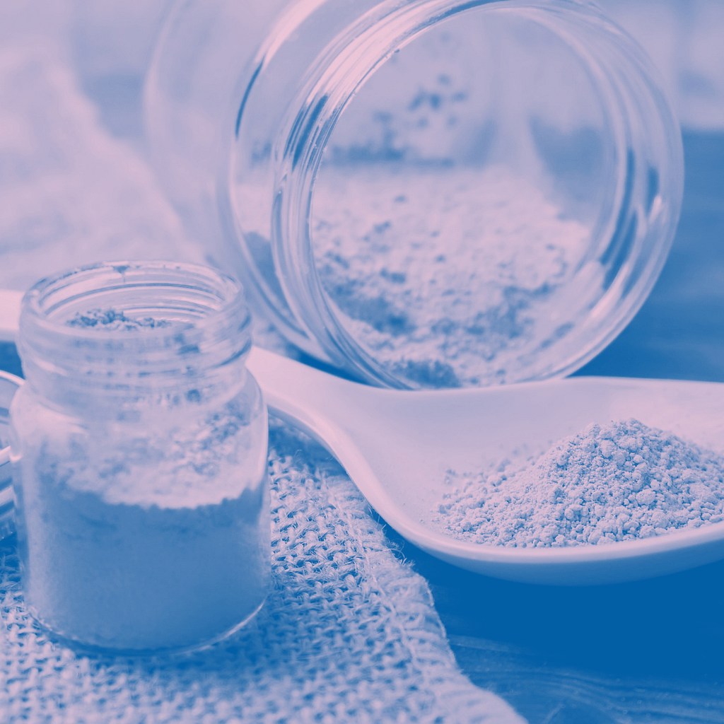 Comprehensive Guide To Navigating Kratom Withdrawal 8 Image Of A Spilled Jar Of Kratom Powder And A Pile Of Kratom In A Spoon Nearby