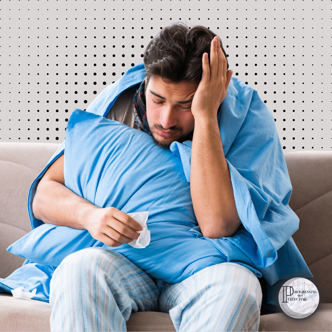 5_20240610_230034_0004 A Man Sitting On A Couch With A Blanket Covering His Face