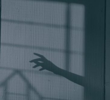 Image Is A Shadow Hand Reaching Out For Something Unseen.