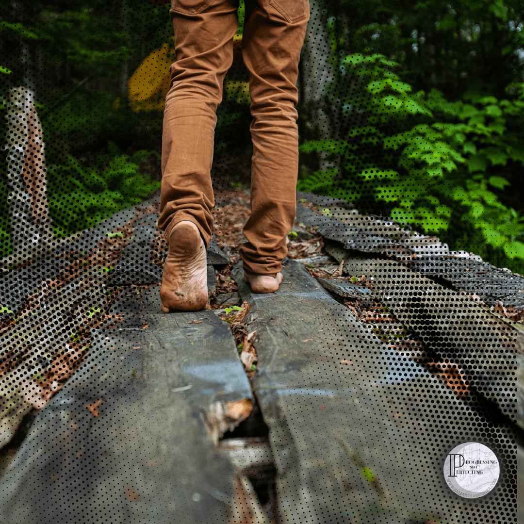 6 A Person Walking On A Wooden Bridge