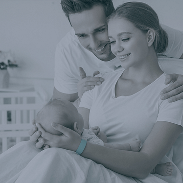 parents holding their newborn baby