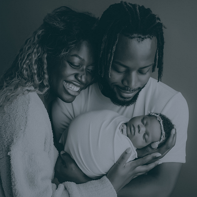 parents holding their newborn baby