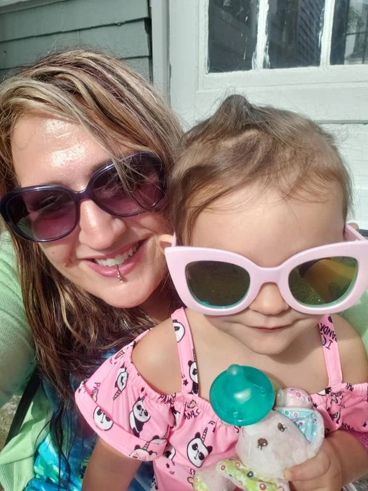 Image of author with small daughter