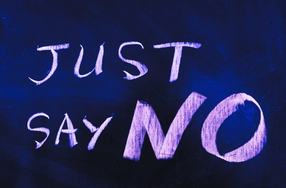The words Just Say No representing being people pleasing and learning to just say no.