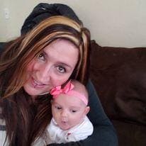 Photo of author and her newborn daughter who saved authors life.