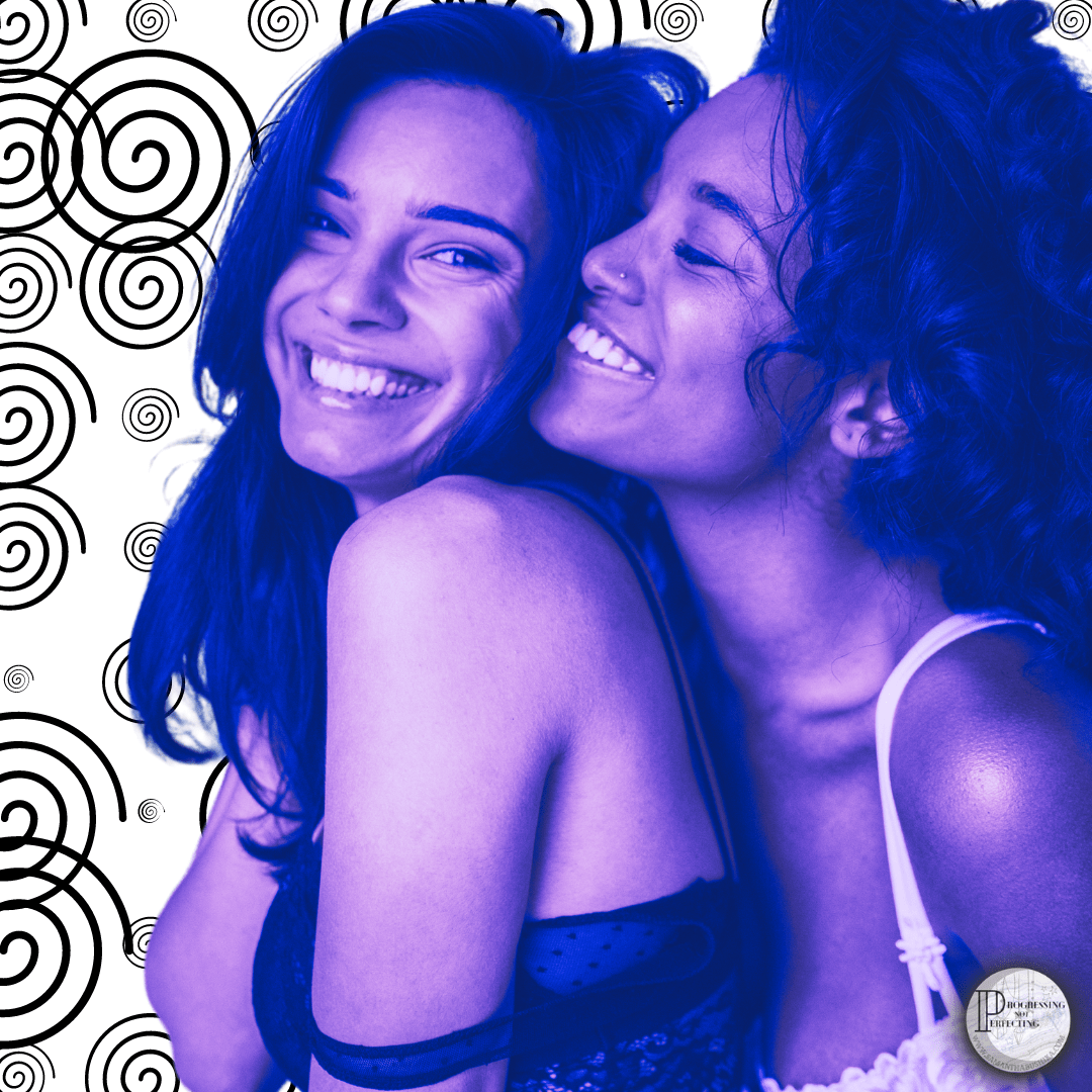 two women smiling and hugging