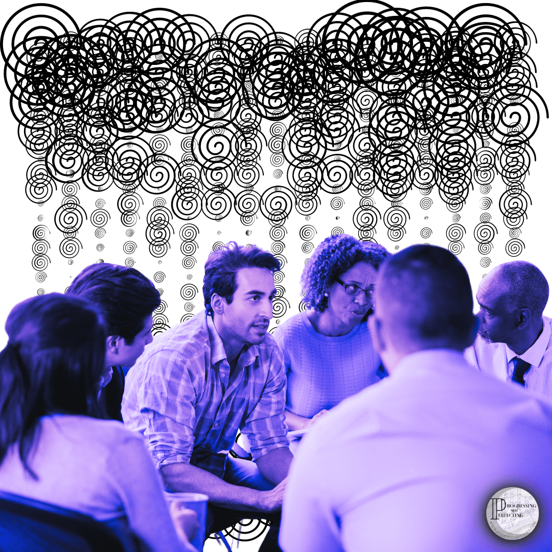 a group of people sitting around a table